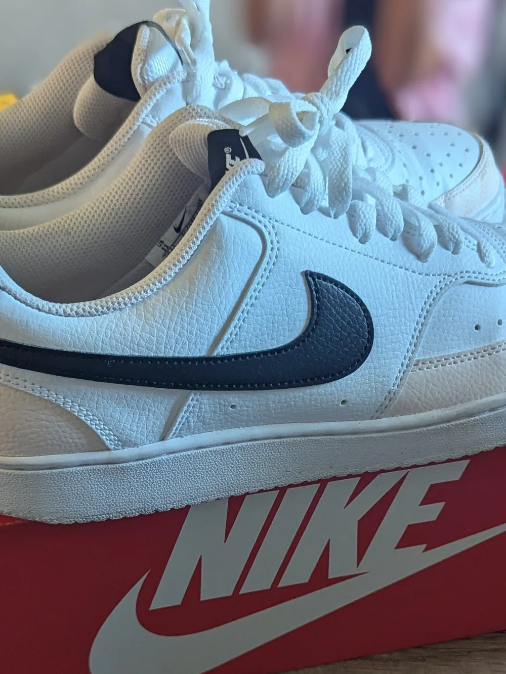 Nike Men’s White Leather Sneakers with Black Swoosh